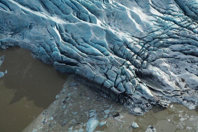 Airplane flight over glacier lagoons and Iceland's highest peak - Hvannadalshnjúkur, Iceland’s highest peak
