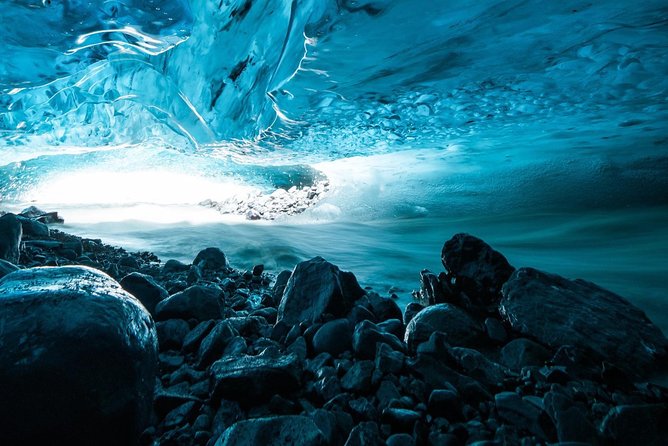 Blue Ice Cave Adventure - Hiking across rough ground toward the ice