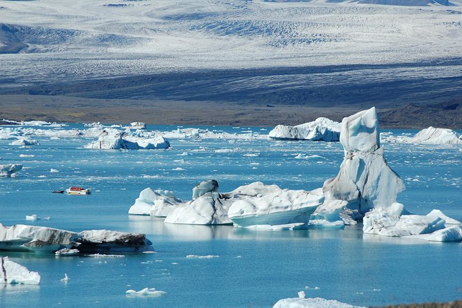 Guided Glacier Lagoon and Diamond Beach Day Trip from Reykjavik - Vík breaks up the evening return