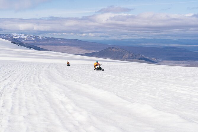 Into the Glacier Combo: Snowmobiling + Langjökull Ice Cave - Riding a shared snowmobile across the glacier
