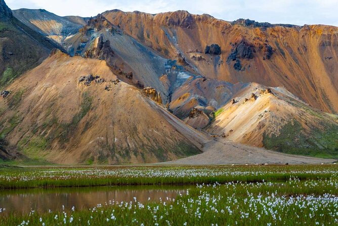 Landmannalaugar Hiking, Haifoss Waterfall and Hot Springs Tour - Bláhylur adds volcanic color and backstory
