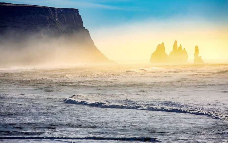The Reynisdrangar sea stacks off the black beach at Vik, late in the day