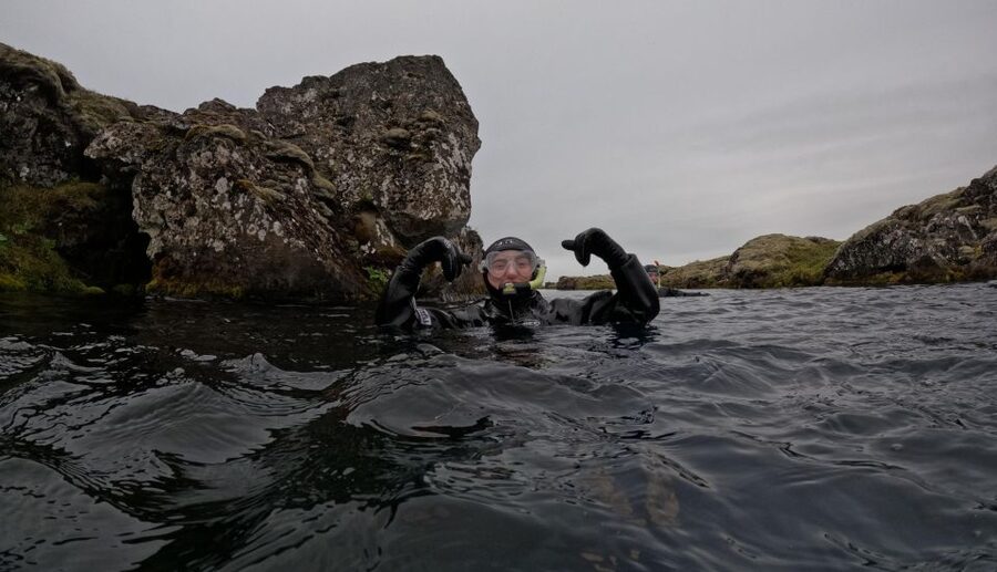 Silfra: Fissure Snorkeling Tour with Underwater Photos - Getting into the dry suit