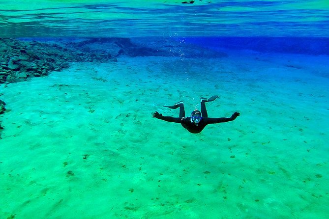 Silfra Wetsuit Snorkeling - Meet on Location | Free Photos - The guide makes the difference