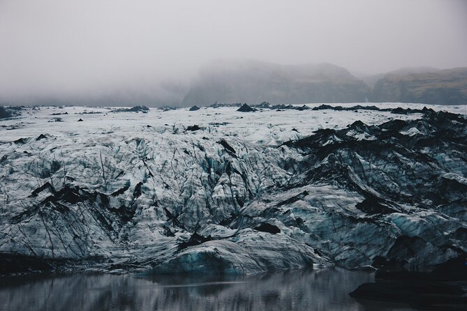 South Coast, Waterfalls and Black Sand Beach (Small Group Tour) - Sólheimajökull, a close look at Icelandic ice